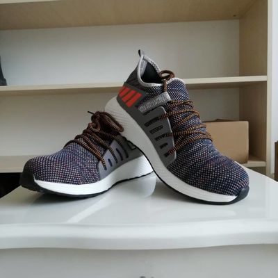 Chaussures de travail en tricot volant respirant chaussures de sécurité confortables chaussures à semelle intercalaire en Kevlar