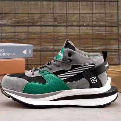 Des chaussures de sécurité en métal à orteils à mi-coupe en cuir de porc et en tricot volant pour le travail de sécurité OEM